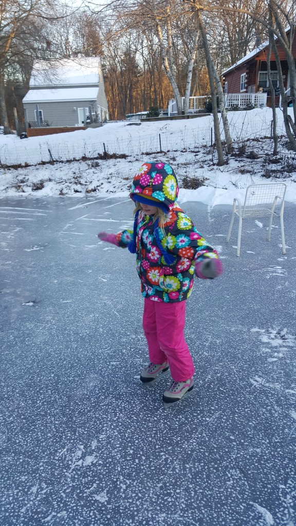girl skating on frozen pond